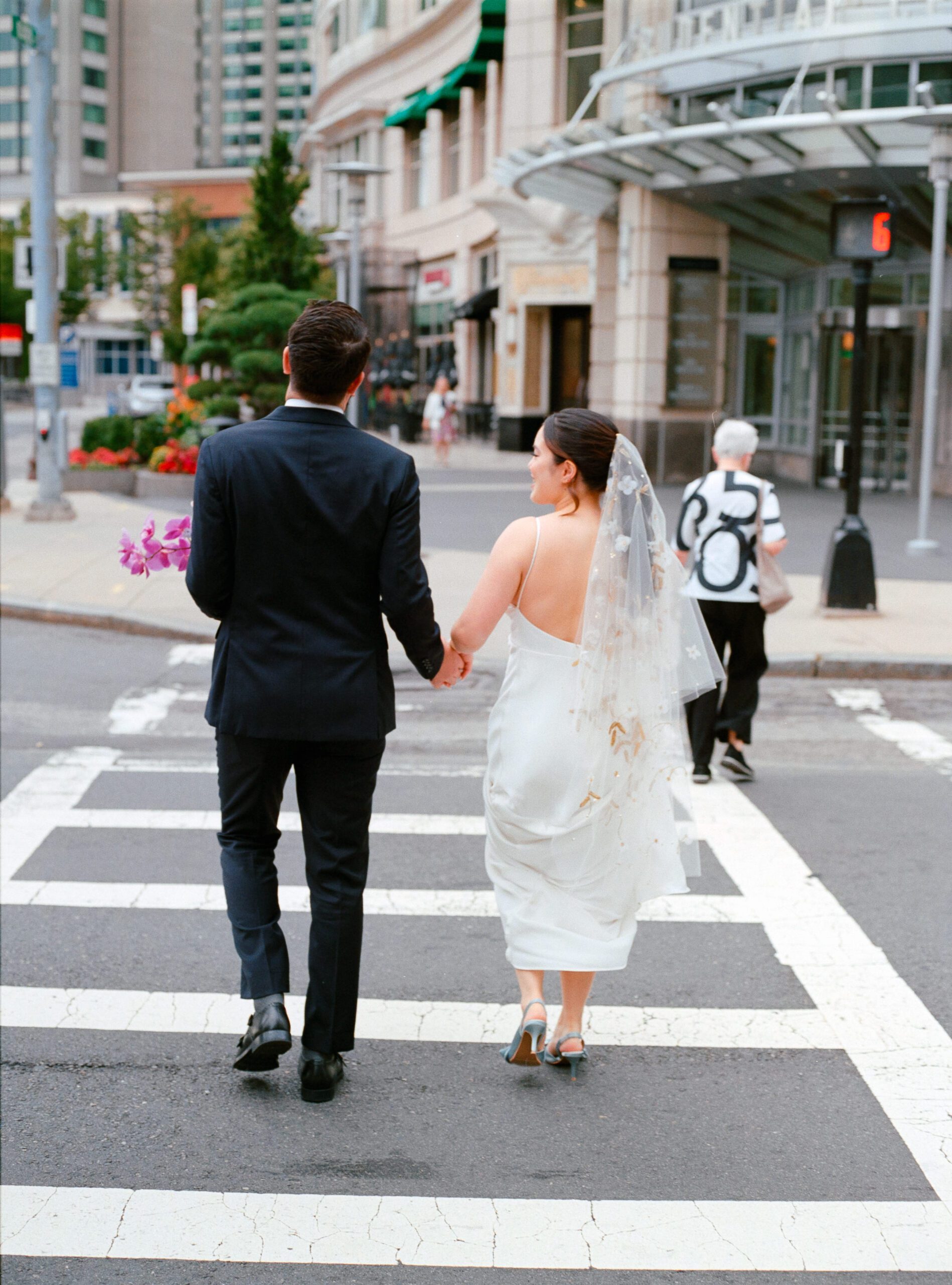 Wedding couple walking through Boston on film photography