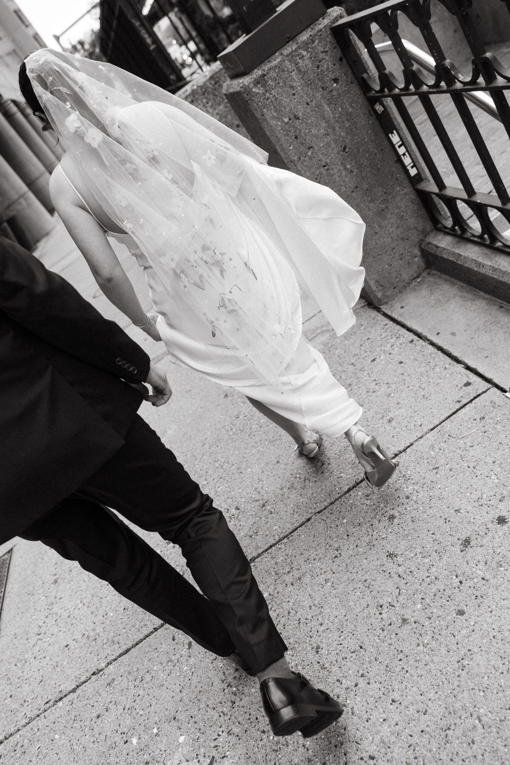 Wedding couple walking through Boston